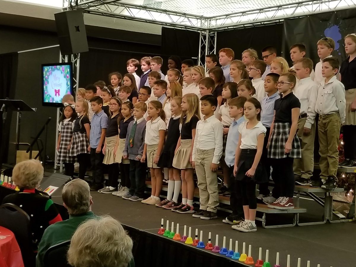 Students performing in a school choir program